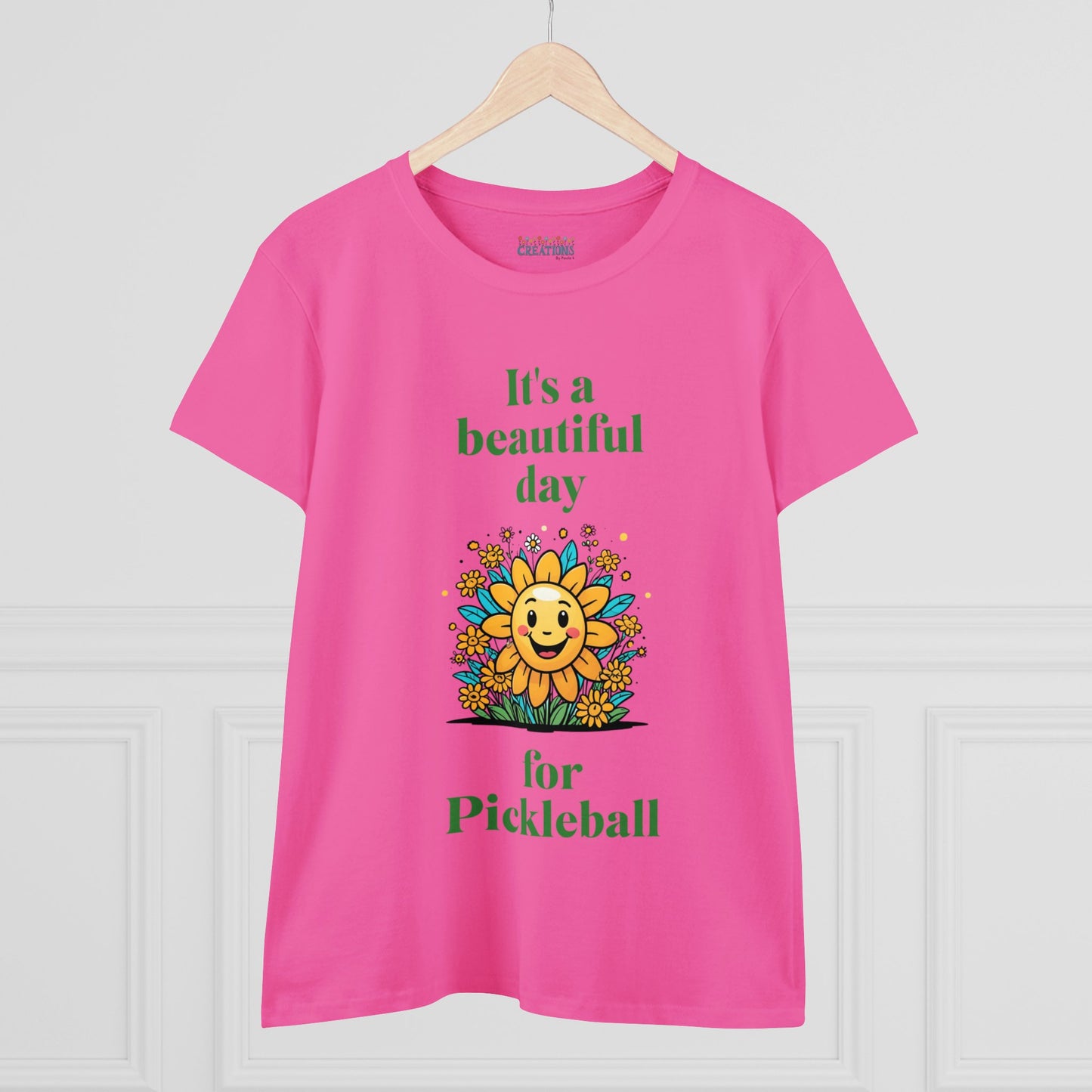 Women's Midweight Cotton Tee featuring a cheerful sun surrounded by flowers and the uplifting words, "It's a beautiful day for pickleball."