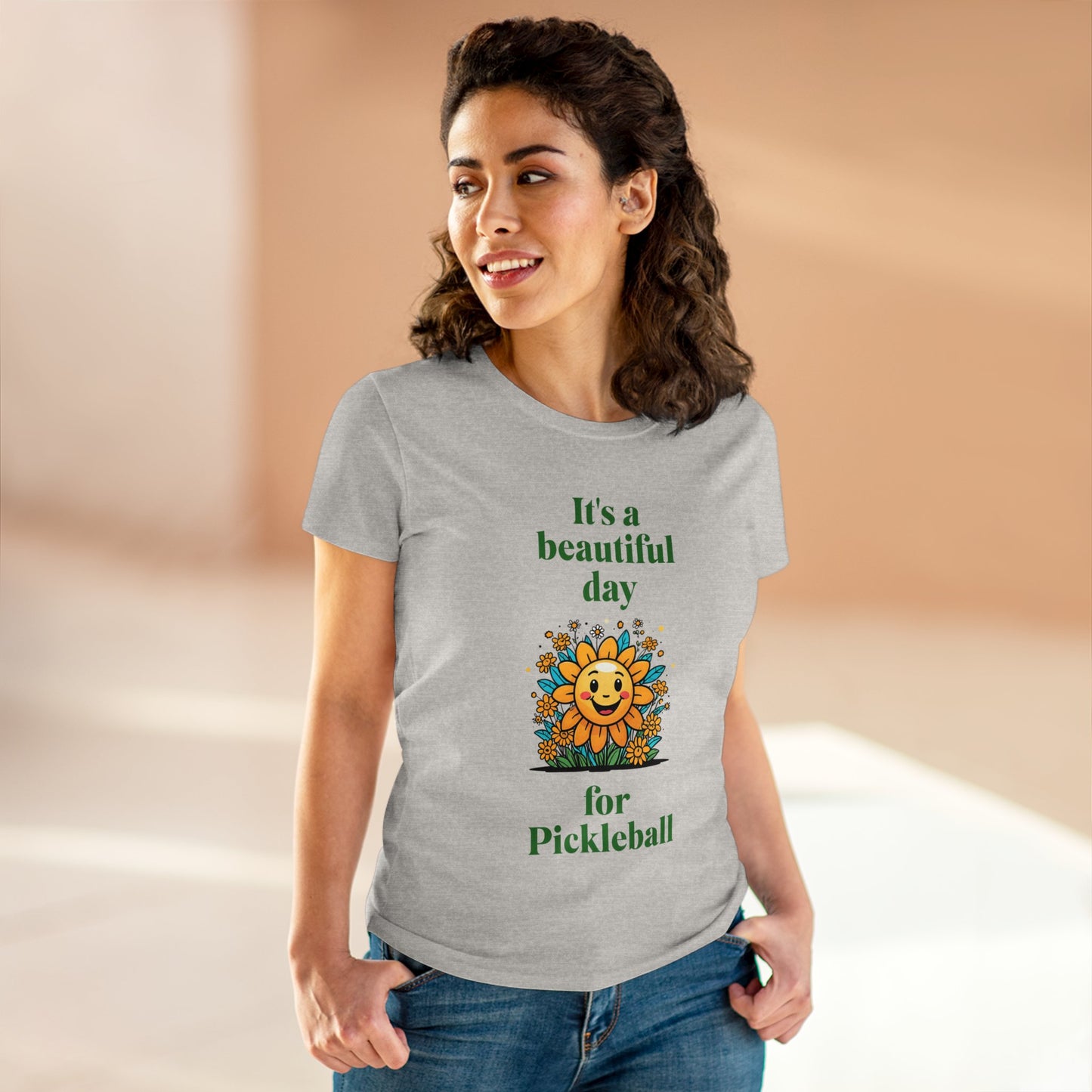 Women's Midweight Cotton Tee featuring a cheerful sun surrounded by flowers and the uplifting words, "It's a beautiful day for pickleball."