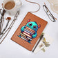 "Elegant Leather Journal – Cute Monster with Stack of Books Design"